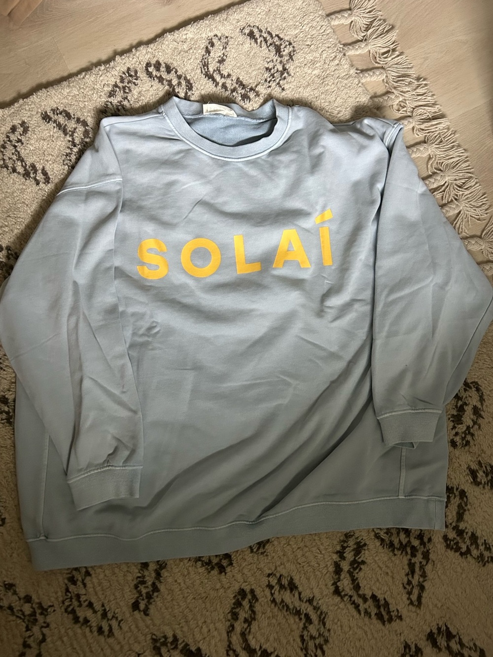 SOLÁI Women's Light Blue Crewneck Sweatshirt with Yellow Logo